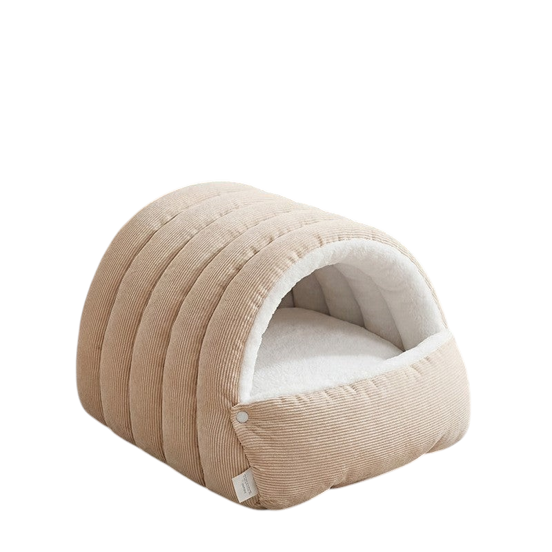 The Tailored Tail washable cave-style cat bed in beige corduroy with a soft white plush interior and snap closures.