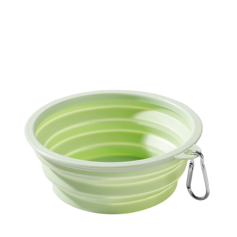 The Tailored Tail light green foldable silicone pet bowl with a metal carabiner for travel and outdoor use